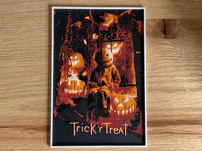Poster of a character from 'Trick 'r Treat' with pumpkins on a wooden surface
