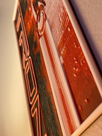 Close-up of a poster cover and text on a blurred background