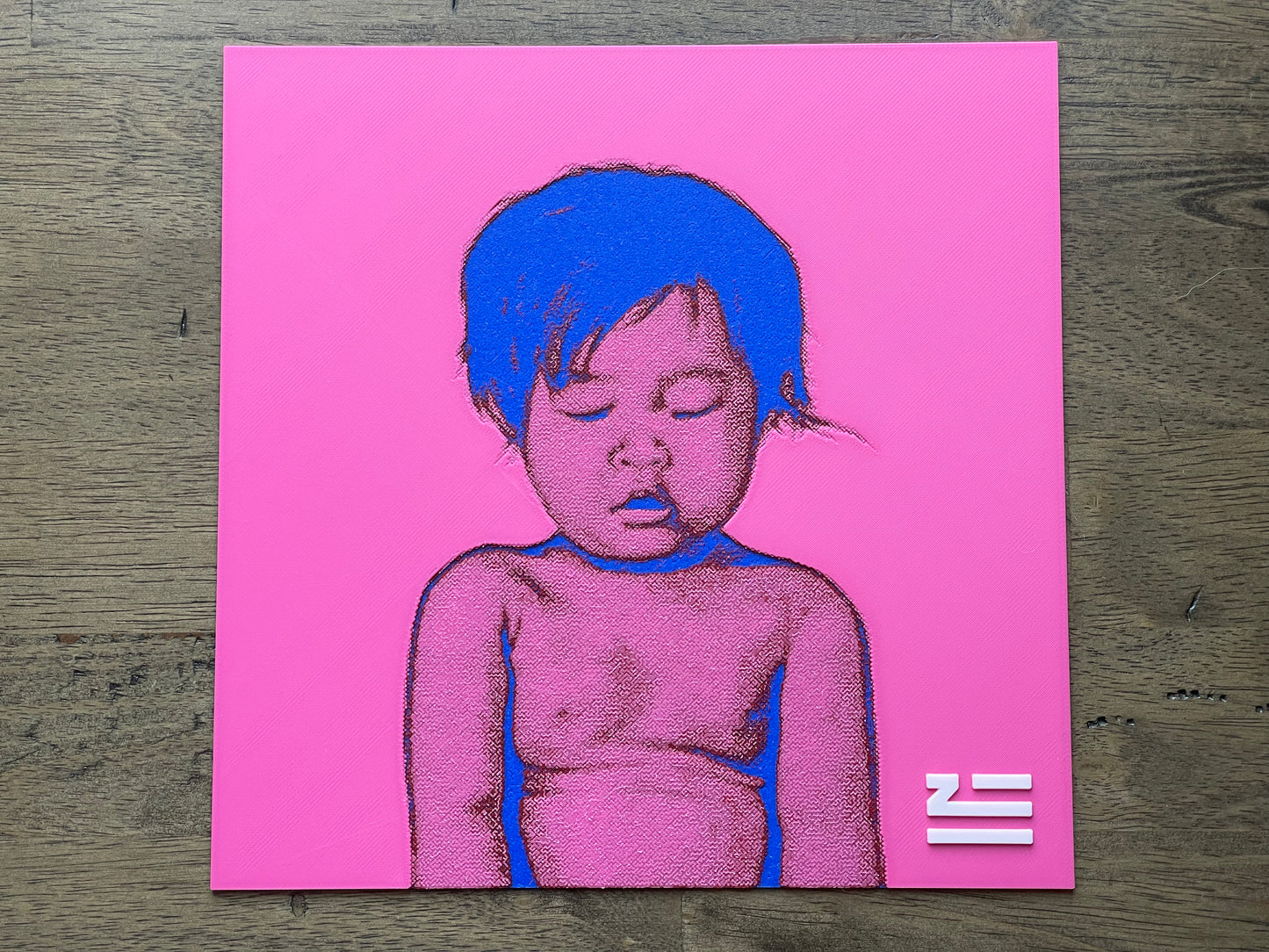 Illustration of a child with blue hair on a pink background