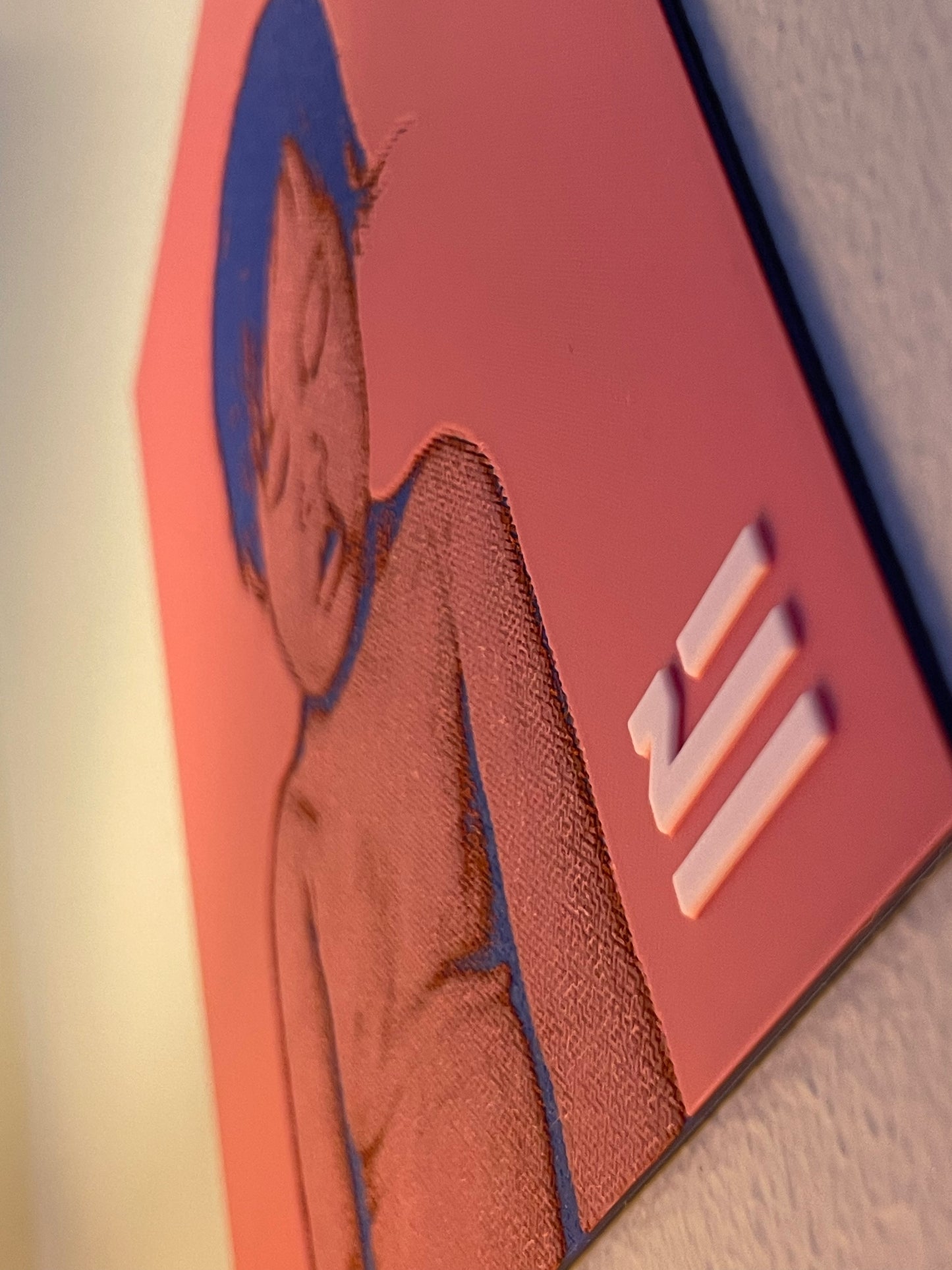 Close-up of a red and blue card with a logo on a textured surface